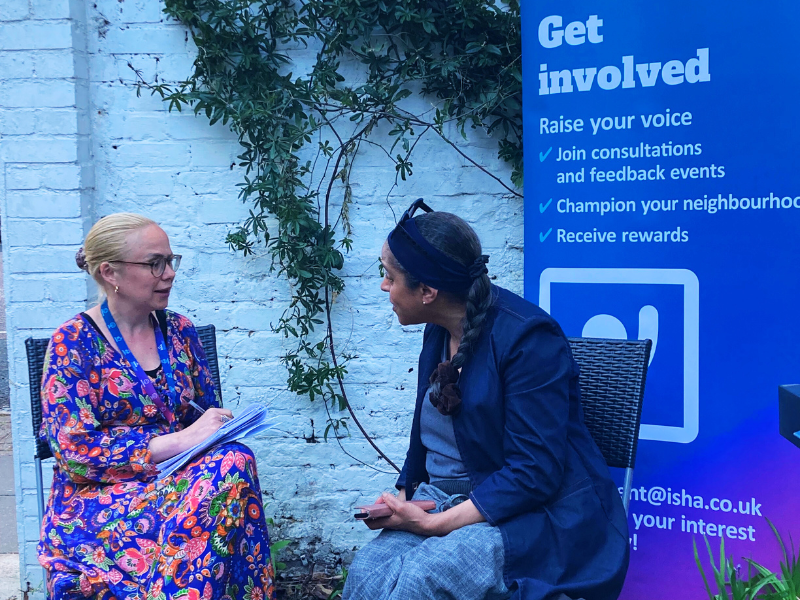Resident Involvement Lead, Sophie talking to an ISHA resident.