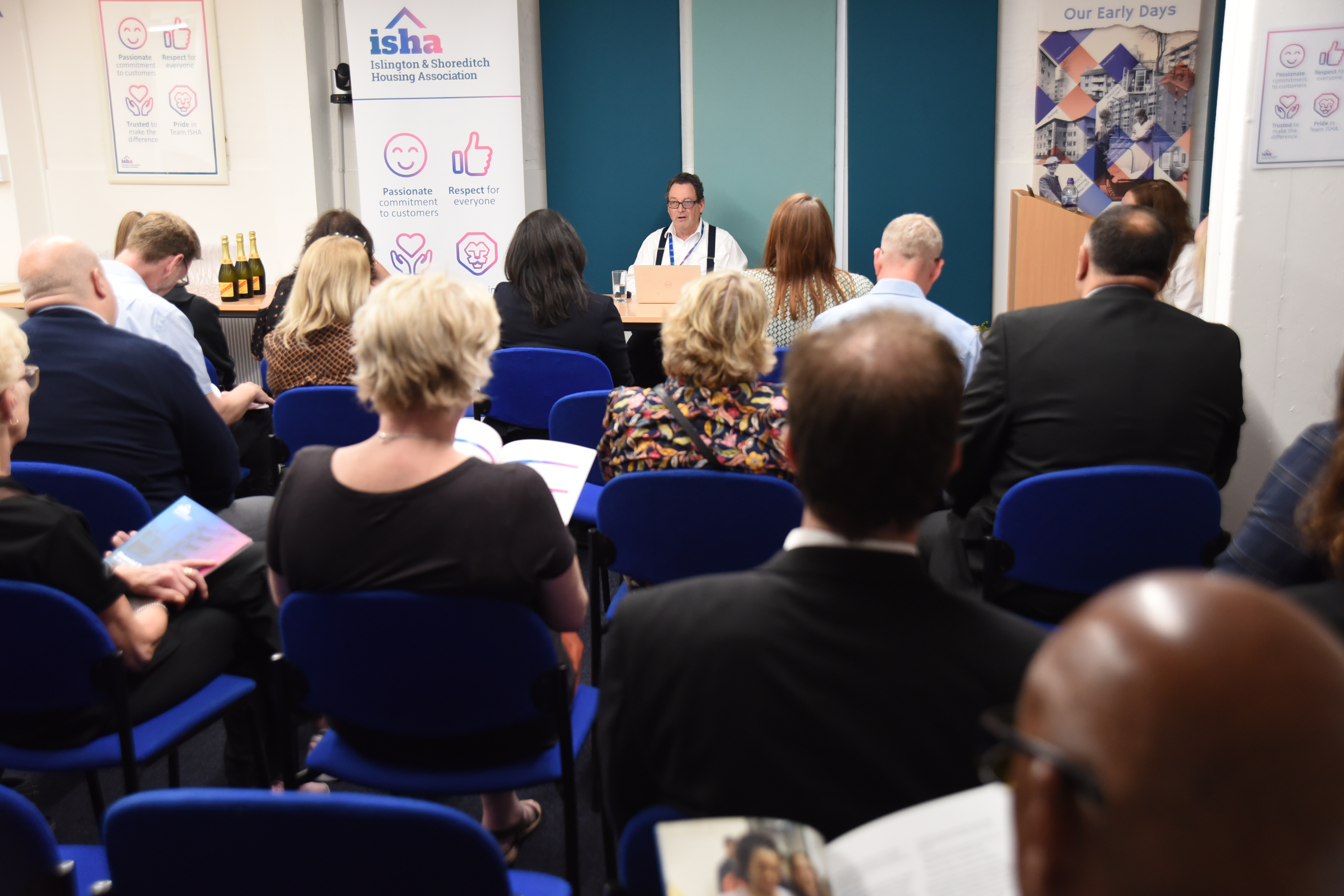 Chair of ISHA's Board presenting to residents at the AGM.