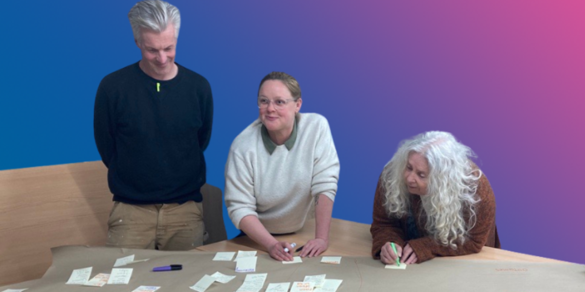 Resident Scrutiny Panel members Brendan, Sarah and Joy doing an exercise during a review meeting.